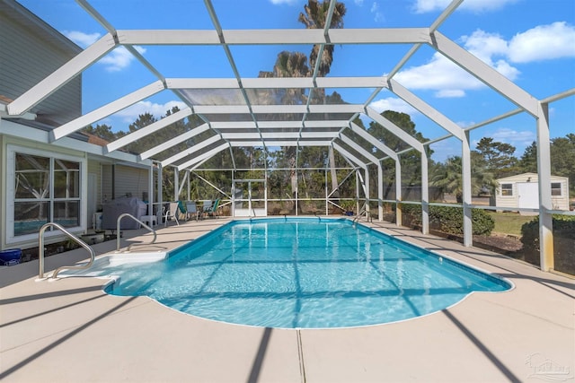 outdoor pool featuring a lanai and a patio