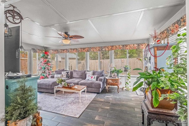 sunroom featuring ceiling fan