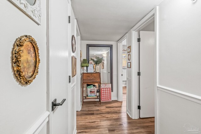 corridor featuring dark hardwood / wood-style floors