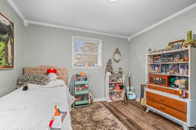 bedroom featuring hardwood / wood-style floors and ornamental molding