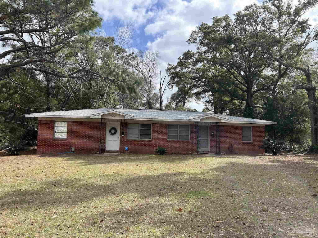 4010 N 8th Ave, Pensacola, FL 32503 - ranch-style house featuring a front lawn and brick siding