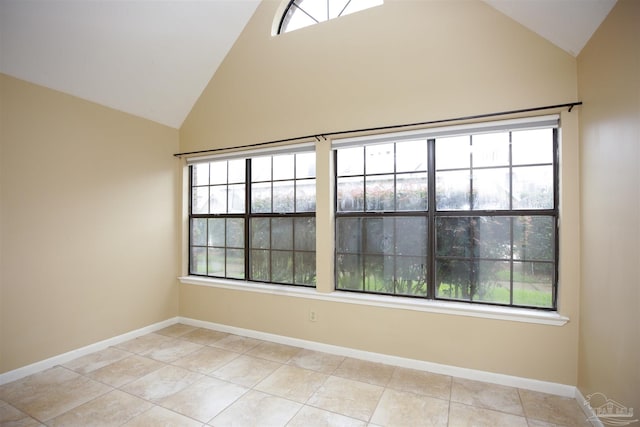 tiled empty room with high vaulted ceiling