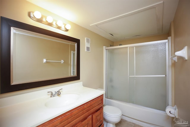 full bathroom featuring tile patterned flooring, vanity, toilet, and combined bath / shower with glass door