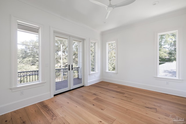 interior space with a ceiling fan and french doors