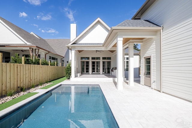 view of pool featuring a fenced in pool, french doors, a patio area, ceiling fan, and a fenced backyard