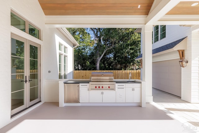 view of patio featuring area for grilling, a grill, fence, french doors, and a sink