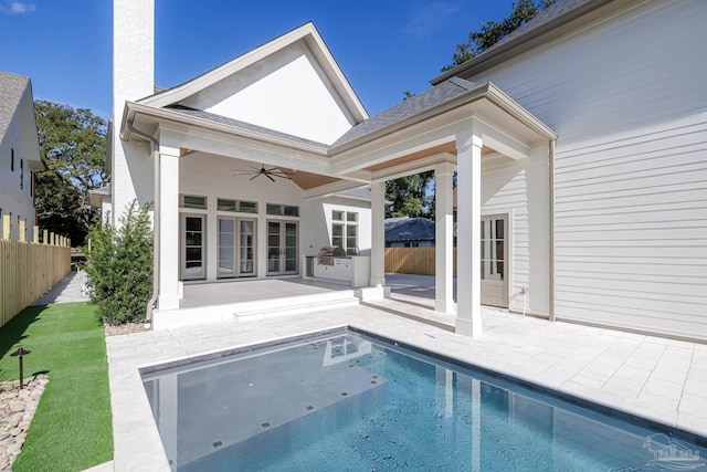 rear view of property featuring a patio, area for grilling, fence, and a ceiling fan