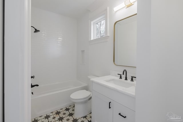 full bath with washtub / shower combination, vanity, toilet, and tile patterned floors