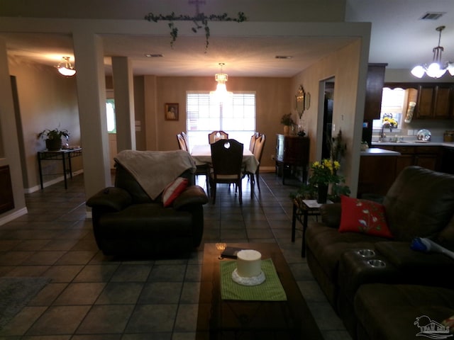 tiled living room featuring sink