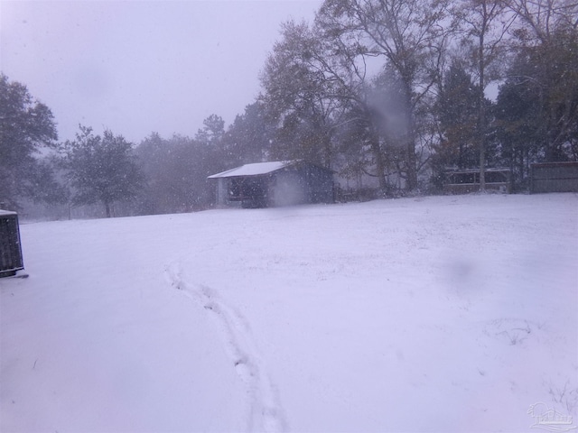 view of yard layered in snow