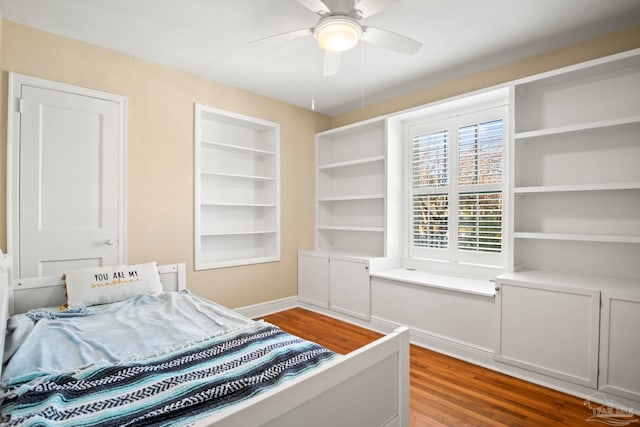 bedroom with ceiling fan and wood-type flooring