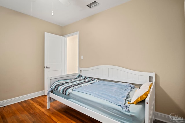 bedroom featuring ceiling fan and hardwood / wood-style floors