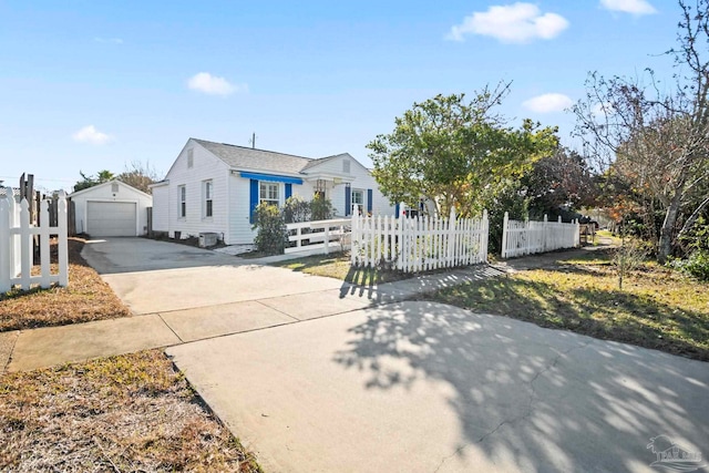 view of front of house with a garage and an outdoor structure