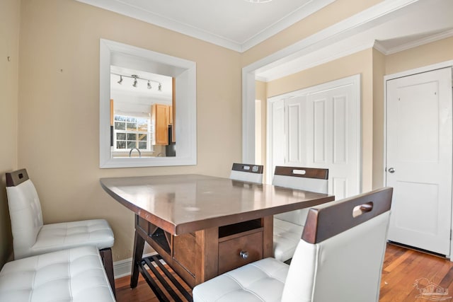 office featuring ornamental molding and hardwood / wood-style flooring