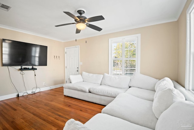 living room with hardwood / wood-style flooring, crown molding, and ceiling fan