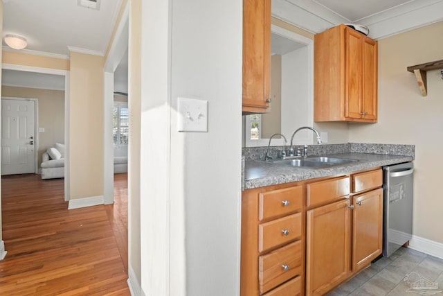 kitchen with crown molding, stainless steel dishwasher, light hardwood / wood-style flooring, and sink