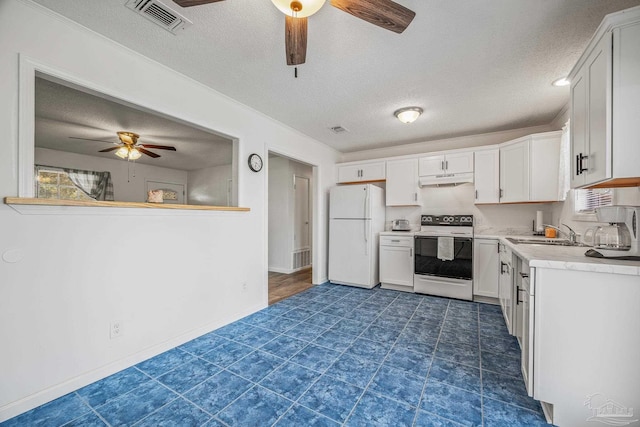 kitchen with white appliances, visible vents, light countertops, under cabinet range hood, and a sink