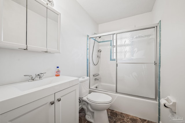 full bathroom featuring enclosed tub / shower combo, vanity, and toilet