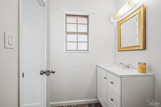 bathroom featuring vanity and baseboards