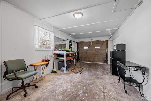 garage with freestanding refrigerator