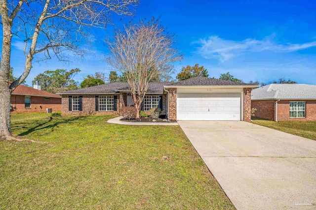 ranch-style home with a garage, a front yard, concrete driveway, and brick siding