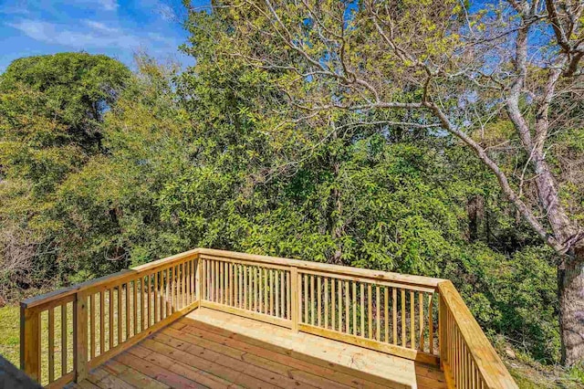 deck featuring a forest view