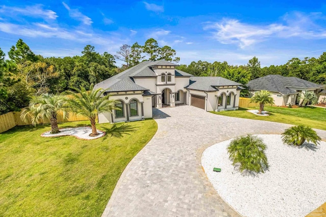 view of front of home featuring a front yard and a garage