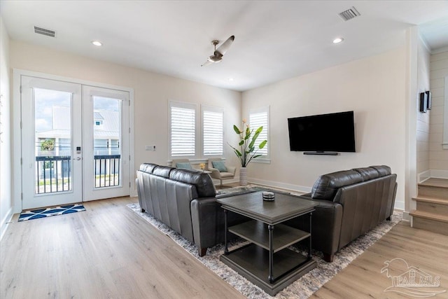 8169 White Sands Blvd, Navarre Beach, FL 32566 - living room featuring french doors, light wood finished floors, baseboards, and recessed lighting