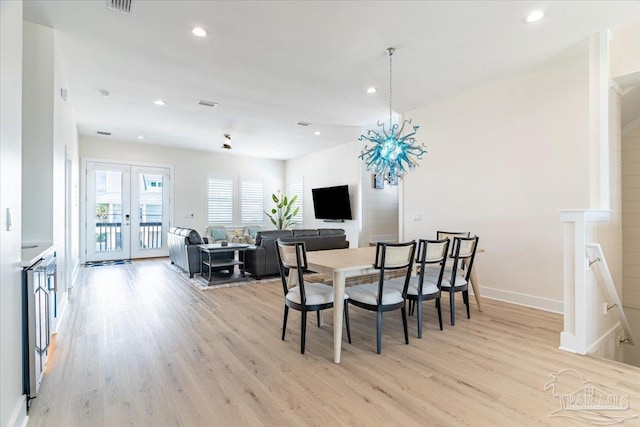 8169 White Sands Blvd, Navarre Beach, FL 32566 - dining room with light wood-style flooring, french doors, recessed lighting, and baseboards