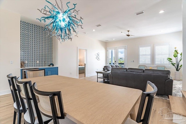 8169 White Sands Blvd, Navarre Beach, FL 32566 - dining area featuring light wood-type flooring, baseboards, french doors, and recessed lighting