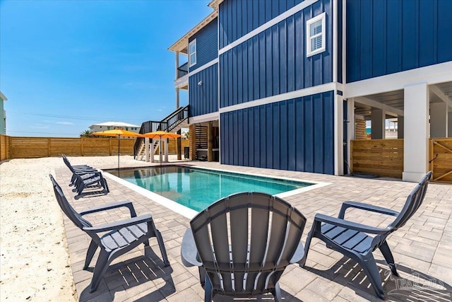 8169 White Sands Blvd, Navarre Beach, FL 32566 - view of pool featuring stairs and a patio