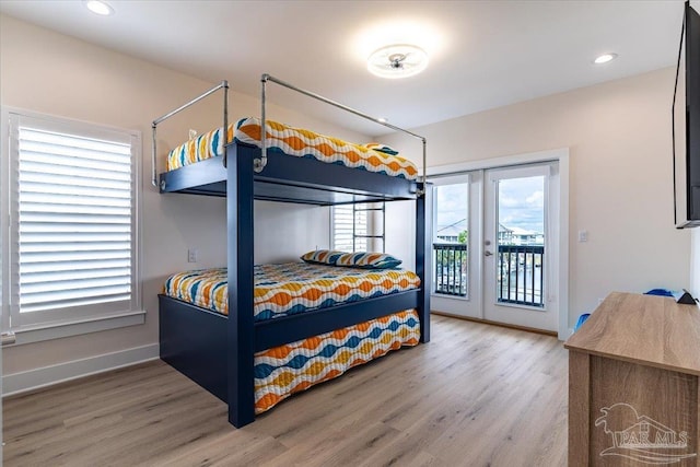 8169 White Sands Blvd, Navarre Beach, FL 32566 - bedroom with access to outside, wood finished floors, french doors, baseboards, and recessed lighting
