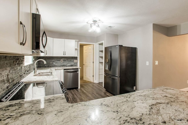 8818 Klondike Rd, Pensacola, FL 32526 - kitchen featuring refrigerator with ice dispenser, dishwasher, decorative backsplash, light stone countertops, and electric stove
