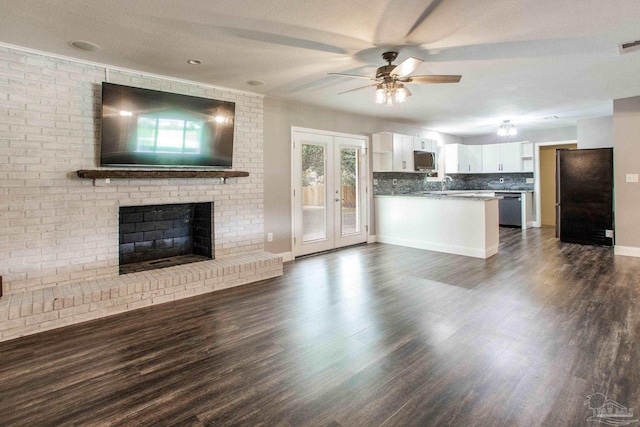 8818 Klondike Rd, Pensacola, FL 32526 - kitchen with appliances with stainless steel finishes, open floor plan, ceiling fan, white cabinetry, and a textured ceiling