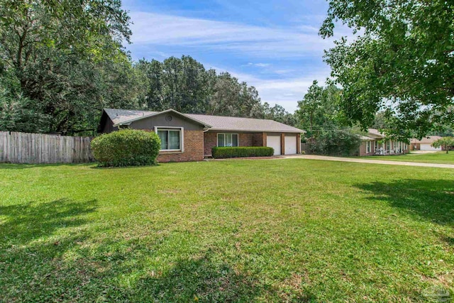 8818 Klondike Rd, Pensacola, FL 32526 - single story home with a garage, concrete driveway, and brick siding