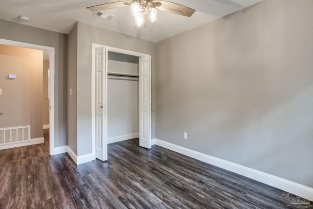8818 Klondike Rd, Pensacola, FL 32526 - unfurnished bedroom featuring dark wood-type flooring, a closet, and ceiling fan