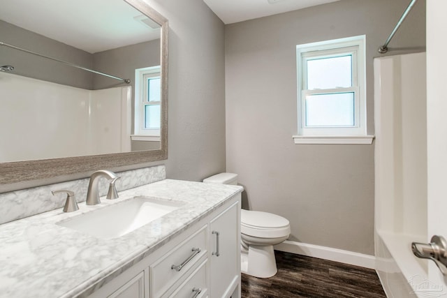 8818 Klondike Rd, Pensacola, FL 32526 - bathroom with vanity, wood finished floors, and washtub / shower combination