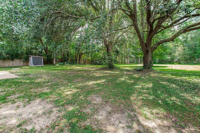 8818 Klondike Rd, Pensacola, FL 32526 - view of yard featuring a storage unit