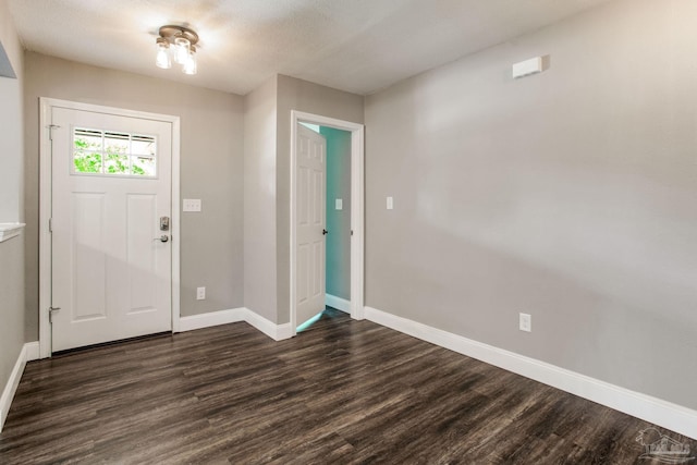 8818 Klondike Rd, Pensacola, FL 32526 - entryway featuring baseboards and dark wood-style floors