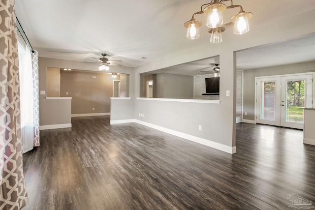 8818 Klondike Rd, Pensacola, FL 32526 - unfurnished living room featuring ceiling fan, dark wood-type flooring, a chandelier, and french doors