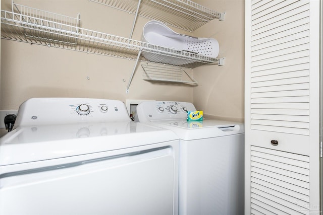 clothes washing area featuring washing machine and clothes dryer