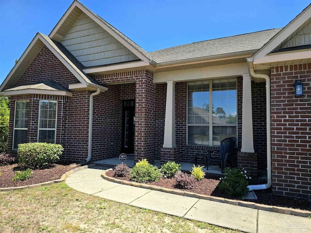 3504 Topaz Cir, Navarre, FL 32566 - entrance to property with brick siding and roof with shingles