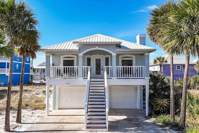 beach home with covered porch and a garage