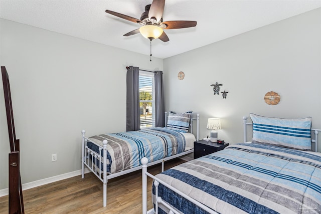 bedroom featuring wood-type flooring and ceiling fan