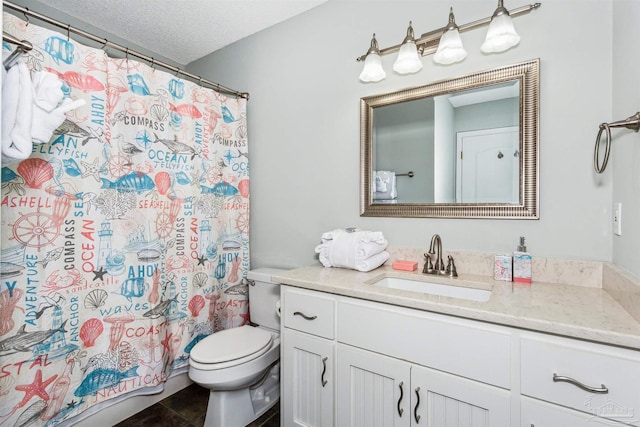 bathroom featuring vanity, toilet, a textured ceiling, and walk in shower