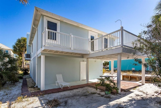 rear view of property featuring a patio