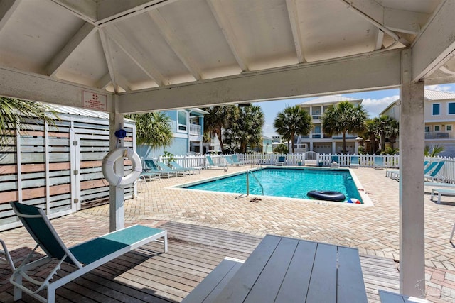 view of swimming pool featuring a patio area