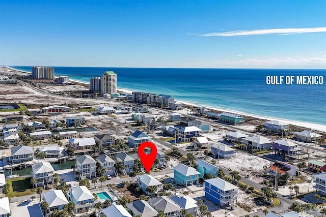 aerial view featuring a water view and a view of the beach