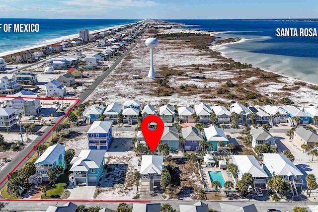 aerial view with a beach view and a water view