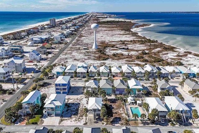 aerial view featuring a water view and a view of the beach